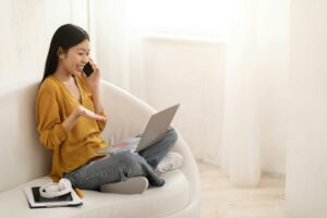 Happy asian woman have conversation with customer service representative